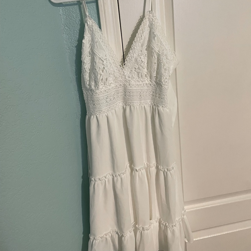 White, backless dress with beautiful stitching